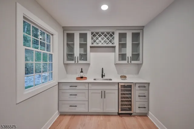 a kitchen with a sink and a window