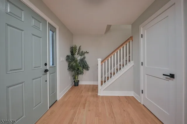 a spacious bedroom with a bed and a television