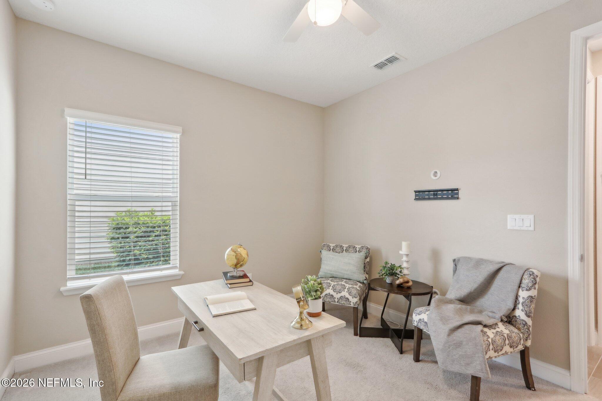 367 Sweet Oak Way St. Augustine, FL 32095 - Photo 7 of 51 a view of a dining room with furniture and a window