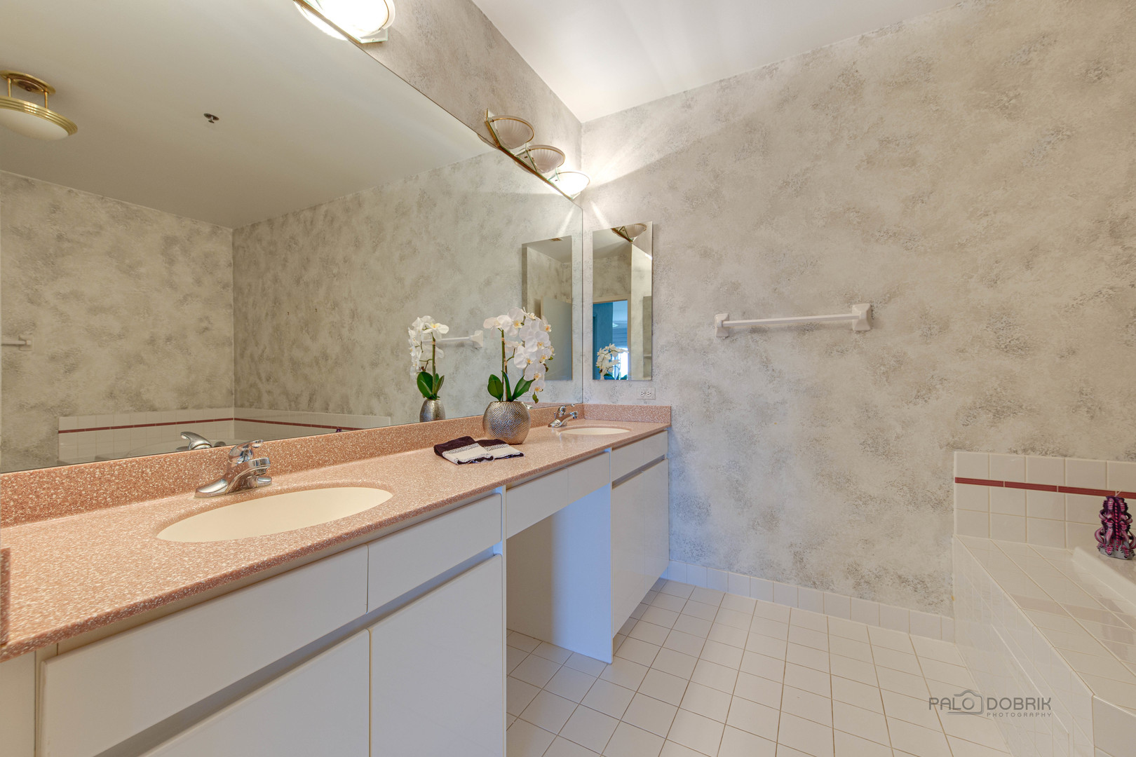 211 Rivershire Lane, Unit 602 Lincolnshire, IL 60069 - Photo 18 of 38 a bathroom with a granite countertop sink and a mirror