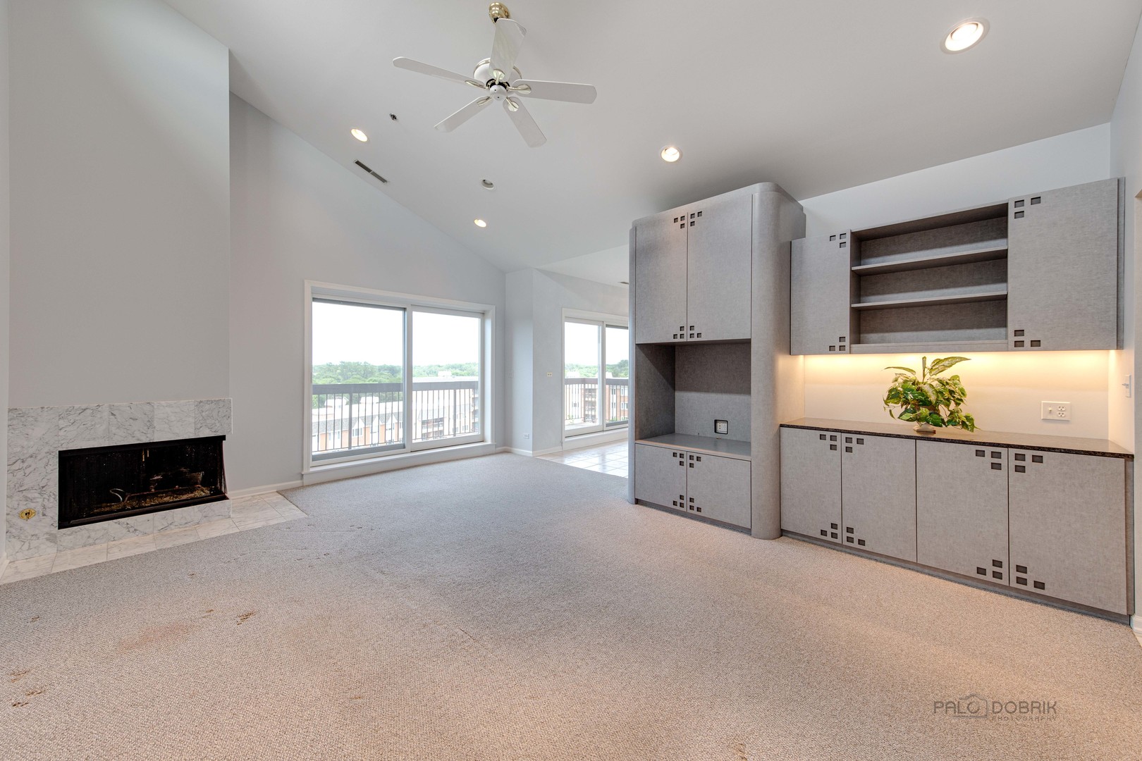 211 Rivershire Lane, Unit 602 Lincolnshire, IL 60069 - Photo 10 of 38 a large bedroom with furniture fireplace and flat screen tv
