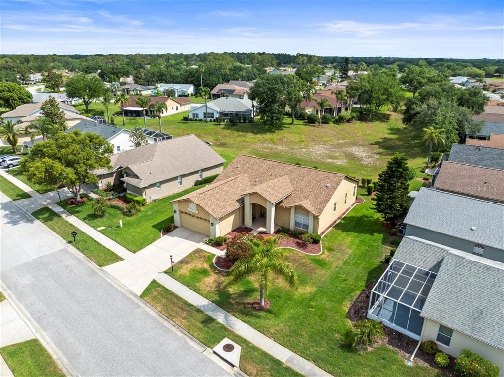 18514 Hidden Pines Way Hudson, FL 34667 - Photo 46 of 57 an aerial view of residential houses with outdoor space and swimming pool
