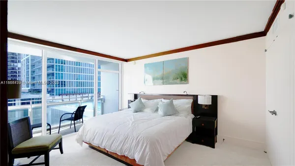 a bedroom with a bed and a fireplace