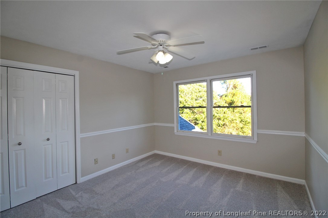 297 Fieldcrest Road Southern Pines, NC 28387 - Photo 21 of 32 a view of an empty room with a window