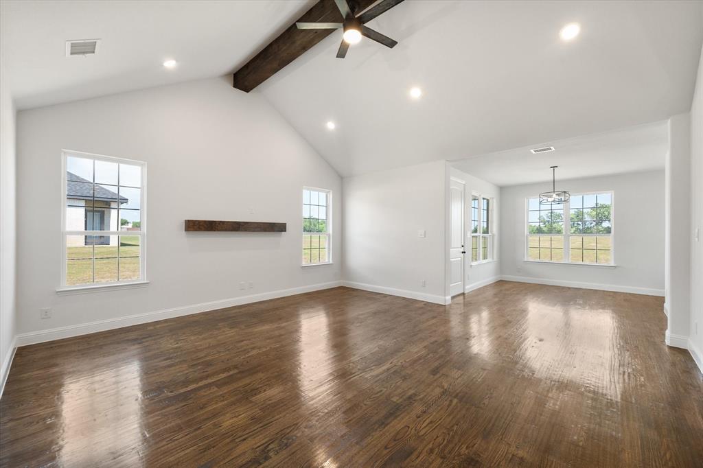 3400 Dobbins Road Corsicana, TX 75110 - Photo 7 of 40 an empty room with wooden floor and windows