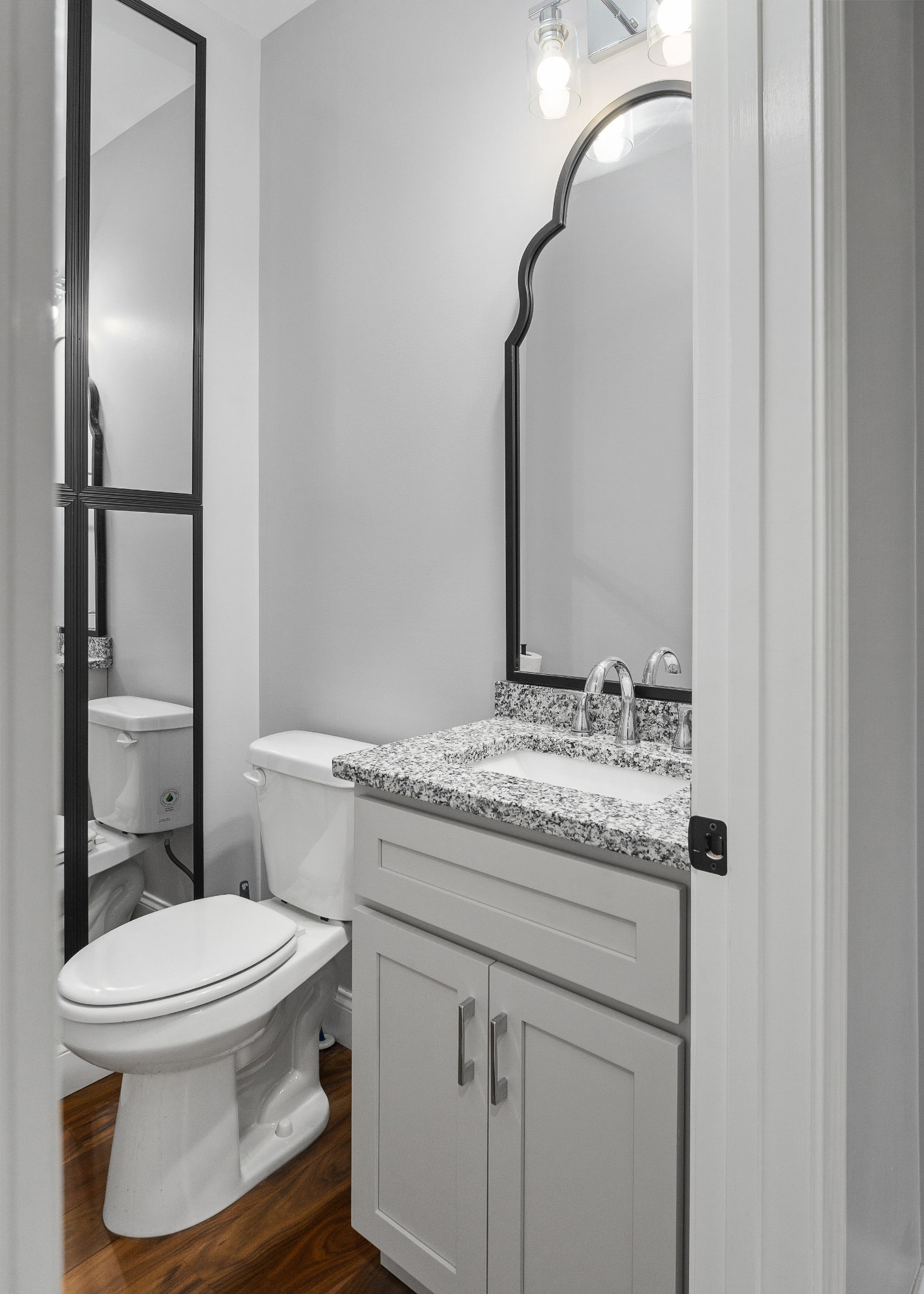 1042 North Spring Street Sparta, TN 38583 - Photo 18 of 36 a bathroom with a granite countertop toilet sink and mirror