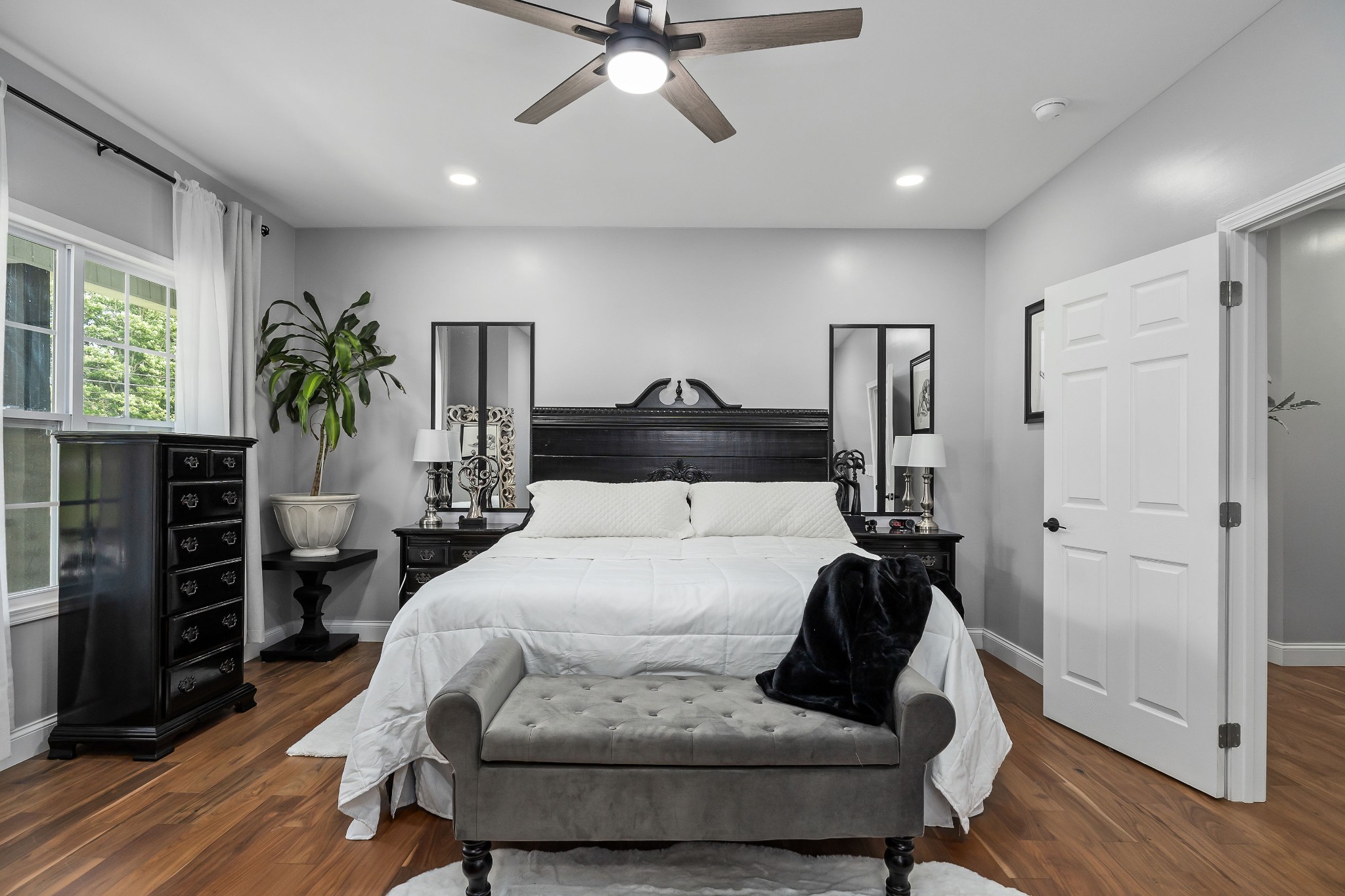 1042 North Spring Street Sparta, TN 38583 - Photo 19 of 36 a bedroom with a bed and wooden floor