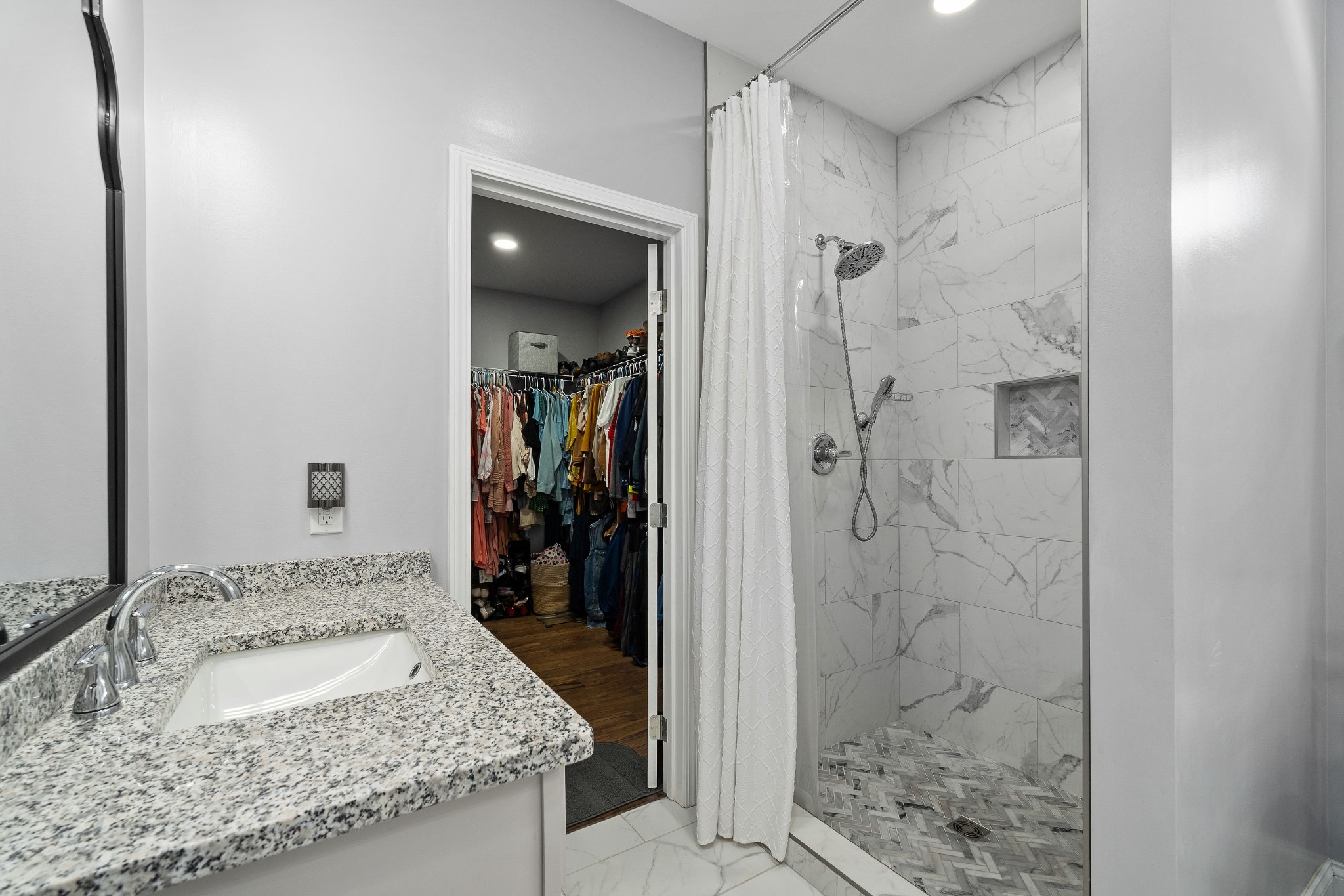 1042 North Spring Street Sparta, TN 38583 - Photo 22 of 36 a bathroom with a granite countertop sink and shower