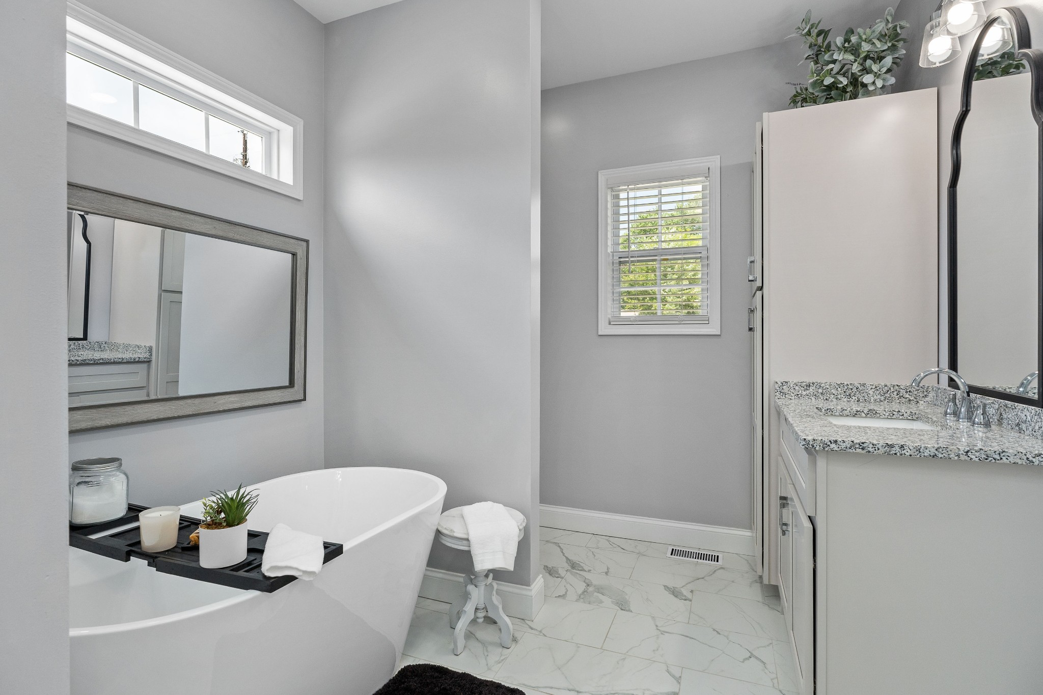 1042 North Spring Street Sparta, TN 38583 - Photo 24 of 36 a bathroom with a granite countertop sink and a mirror