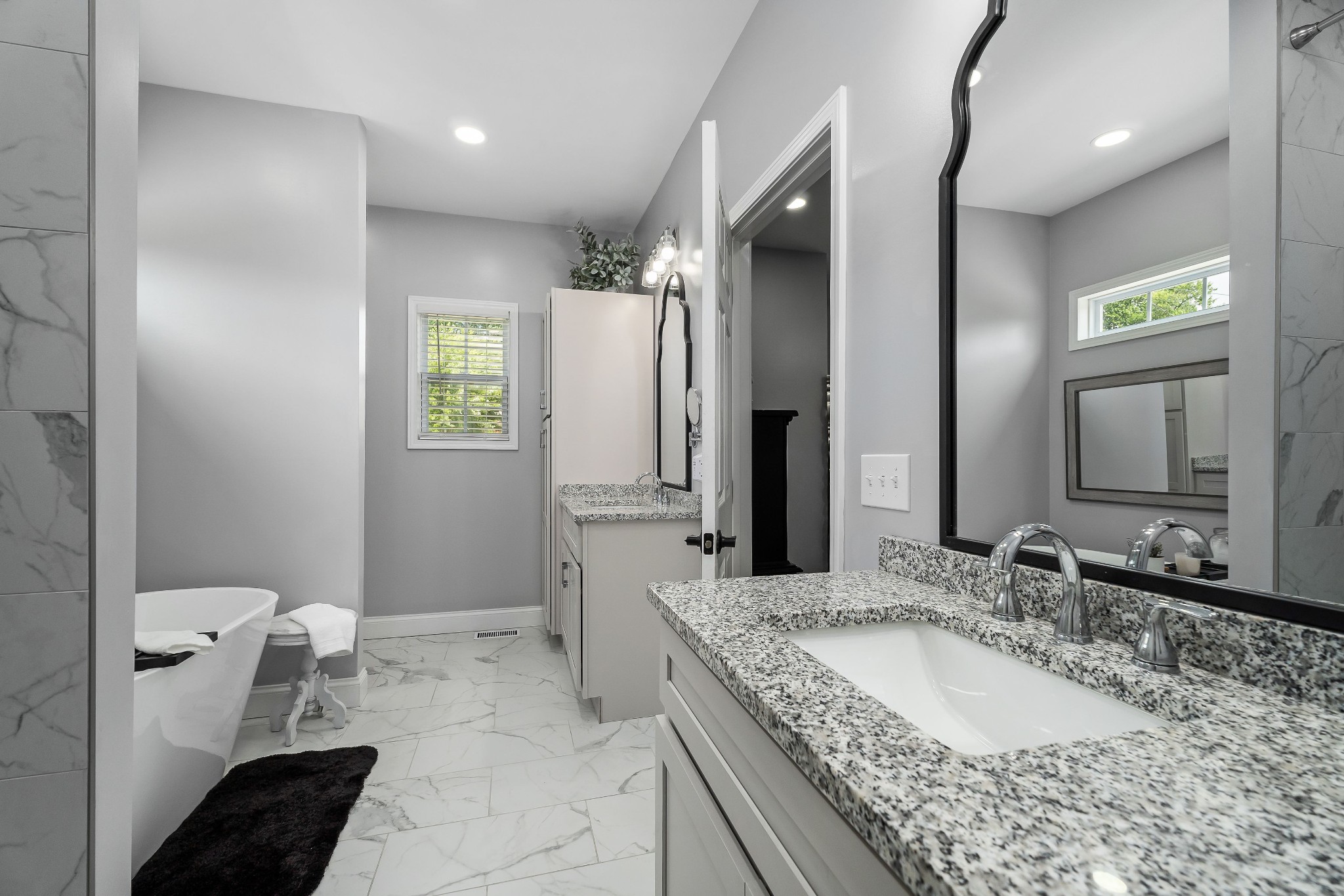 1042 North Spring Street Sparta, TN 38583 - Photo 25 of 36 a bathroom with a granite countertop sink and a mirror