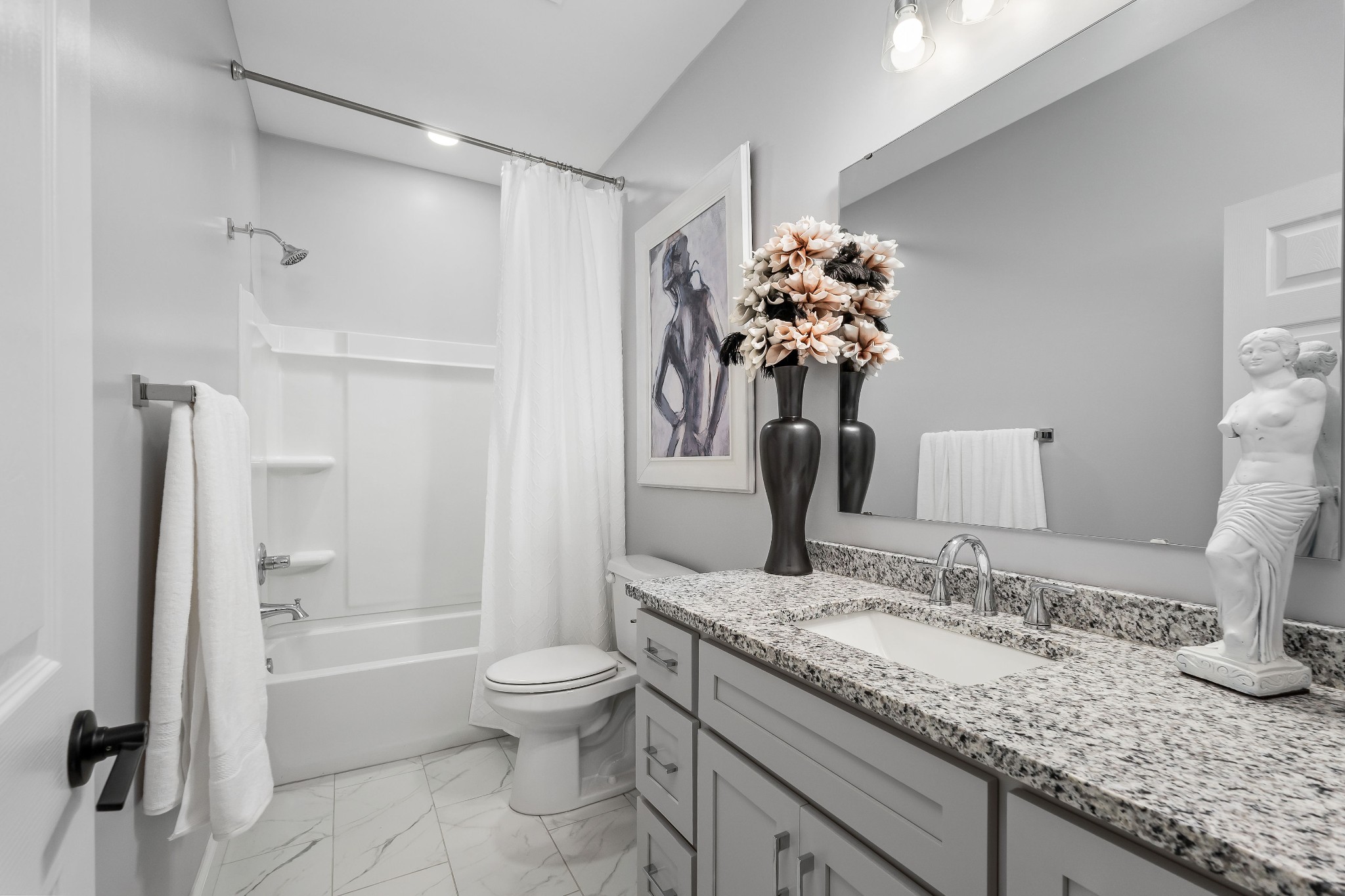 1042 North Spring Street Sparta, TN 38583 - Photo 28 of 36 a bathroom with a granite countertop sink a toilet and shower