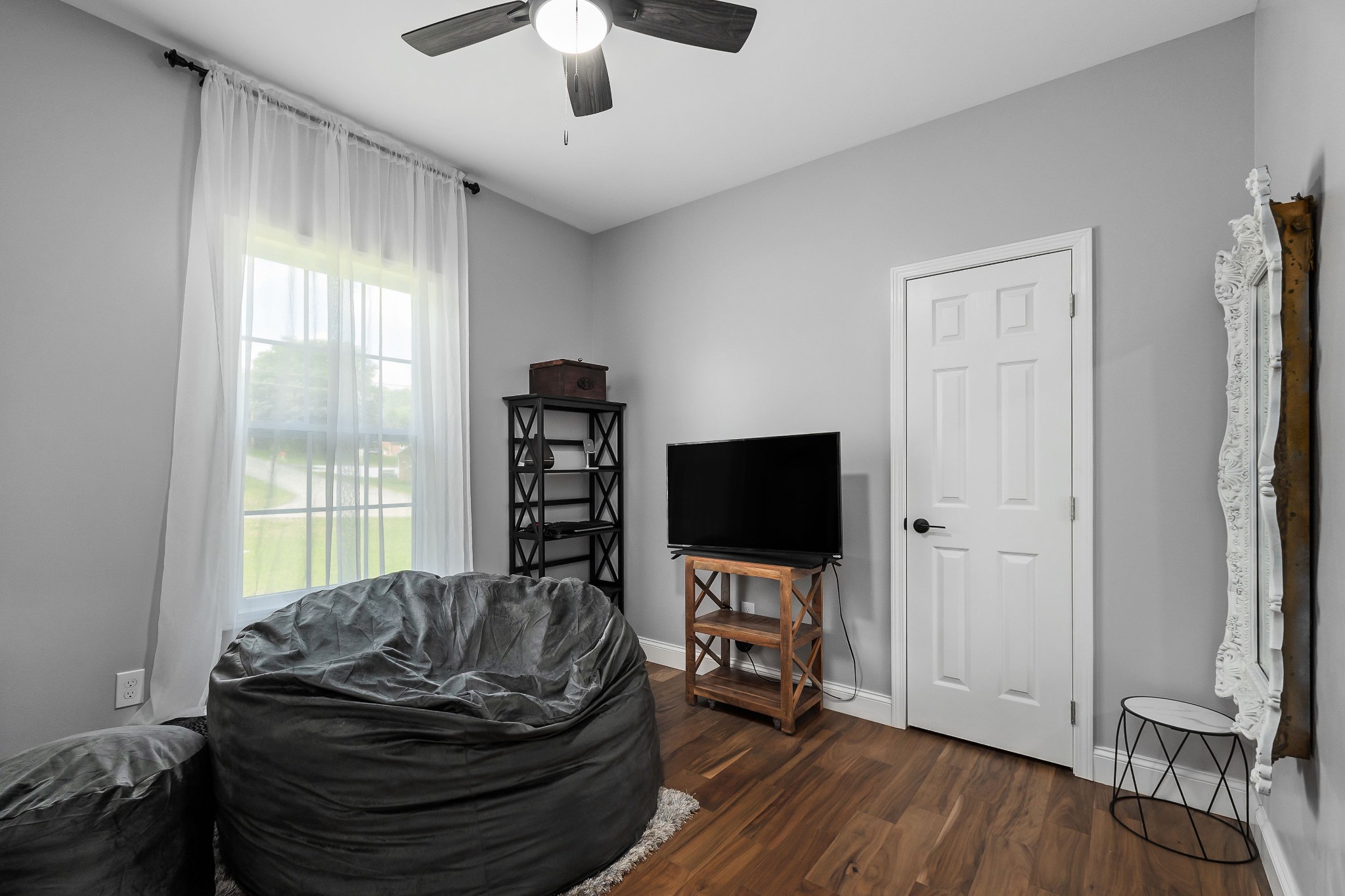 1042 North Spring Street Sparta, TN 38583 - Photo 29 of 36 a living room with furniture and a flat screen tv