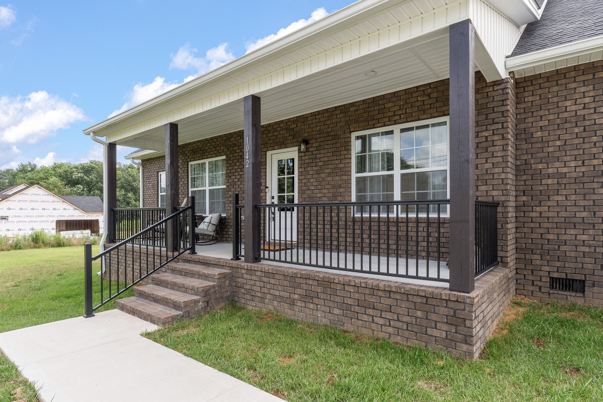 1042 North Spring Street Sparta, TN 38583 - Photo 3 of 36 a front view of a house with a garden