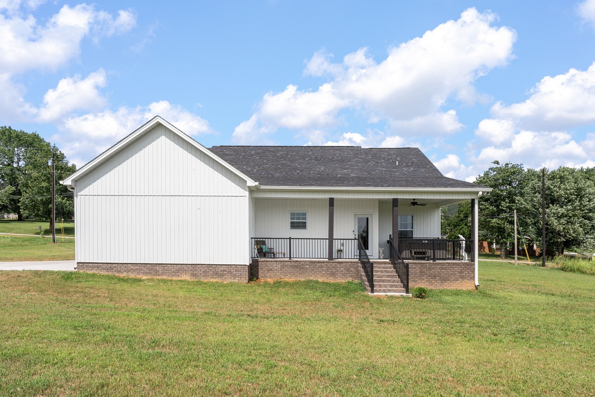 1042 North Spring Street Sparta, TN 38583 - Photo 32 of 36 a backyard of a house with table and chairs