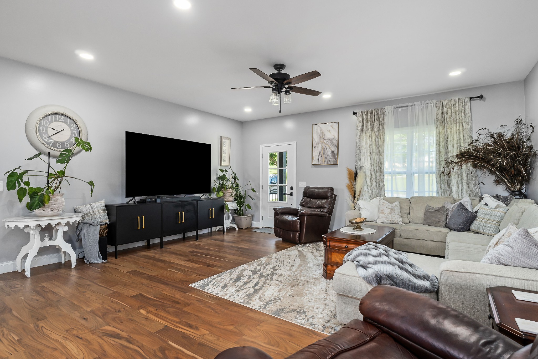 1042 North Spring Street Sparta, TN 38583 - Photo 9 of 36 a living room with furniture and a flat screen tv