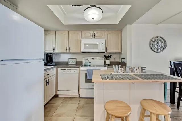 a kitchen with a stove a table and chairs
