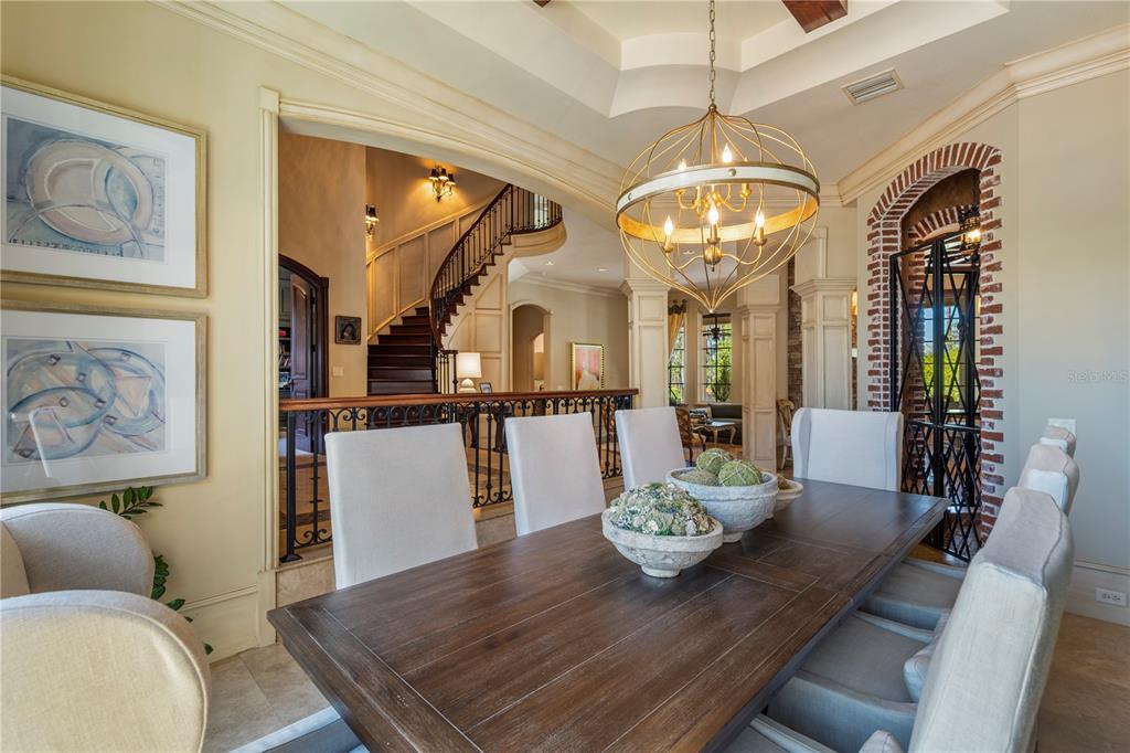 9121 Tibet Pointe Circle Windermere, FL 34786 - Photo 14 of 100 a living room with furniture and a chandelier