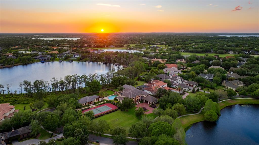 9121 Tibet Pointe Circle Windermere, FL 34786 - Photo 2 of 100 a view of a lake with a city