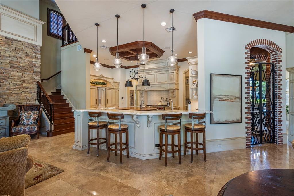 9121 Tibet Pointe Circle Windermere, FL 34786 - Photo 25 of 100 a kitchen with stainless steel appliances granite countertop a stove and a refrigerator