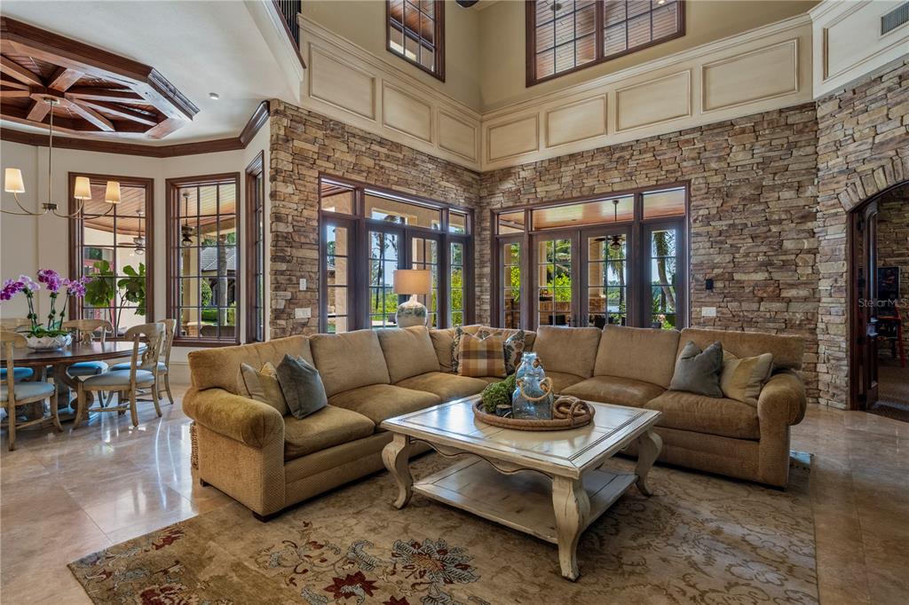 9121 Tibet Pointe Circle Windermere, FL 34786 - Photo 26 of 100 a living room with furniture and a large window