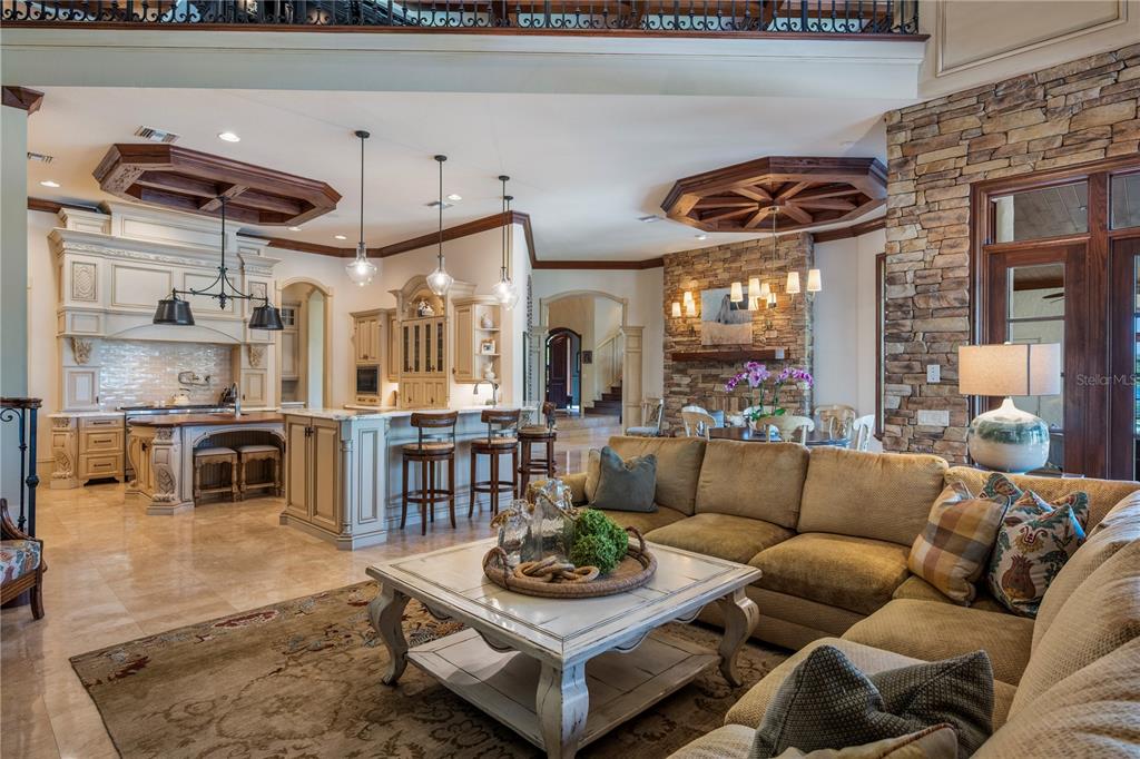 9121 Tibet Pointe Circle Windermere, FL 34786 - Photo 28 of 100 a living room with furniture and a fireplace