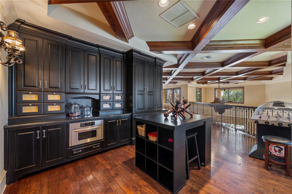 9121 Tibet Pointe Circle Windermere, FL 34786 - Photo 51 of 100 a kitchen with lots of wooden cabinets and stainless steel appliances