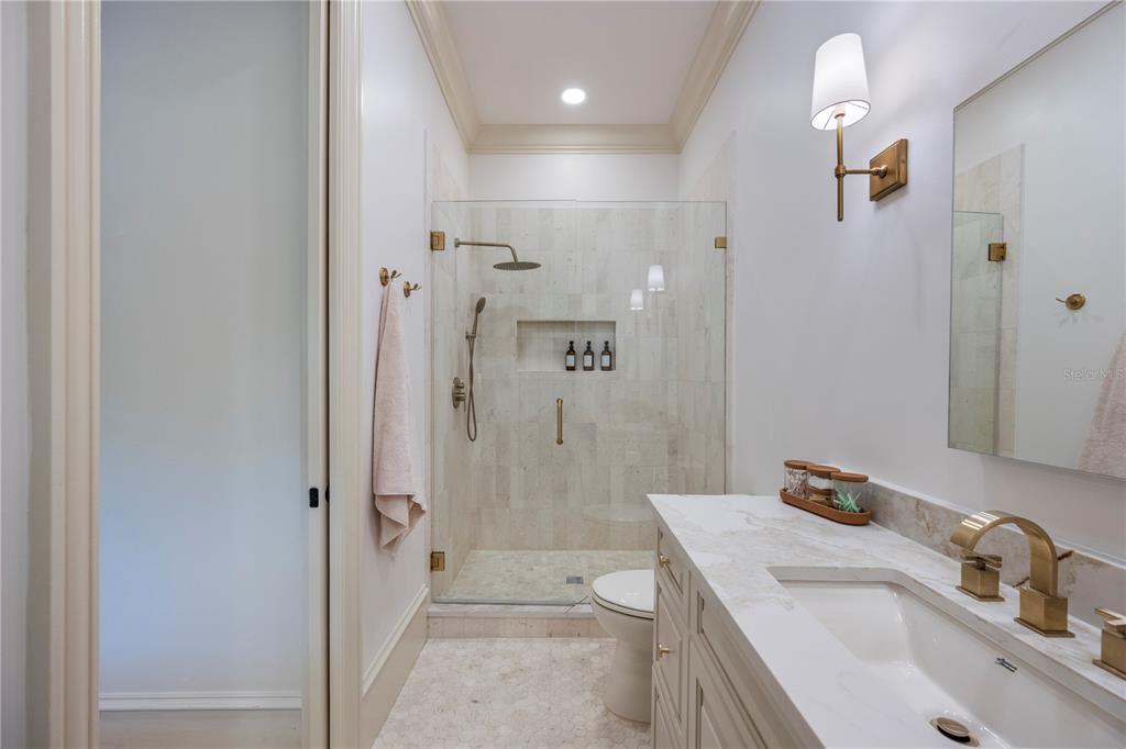 9121 Tibet Pointe Circle Windermere, FL 34786 - Photo 61 of 100 a bathroom with a sink a toilet and shower