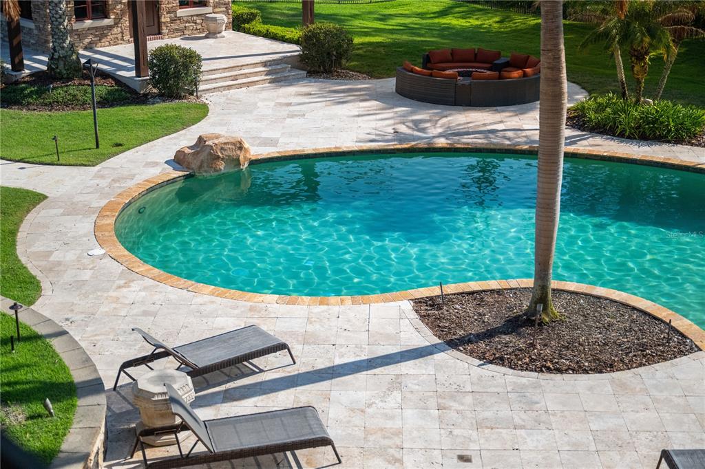 9121 Tibet Pointe Circle Windermere, FL 34786 - Photo 71 of 100 a view of a backyard with table and chairs potted plants
