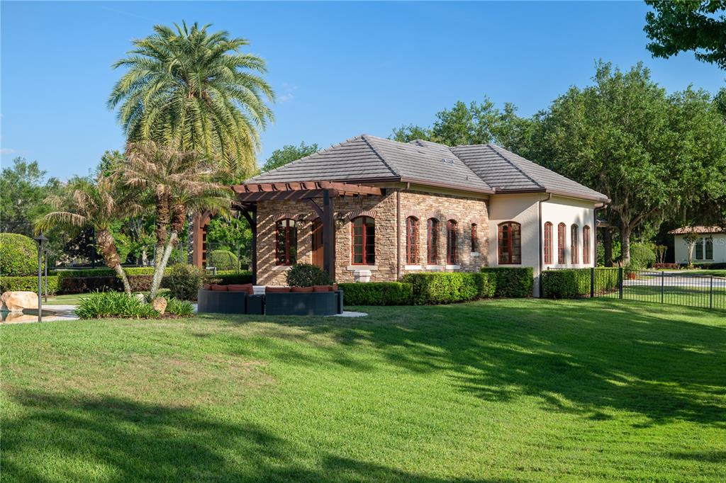 9121 Tibet Pointe Circle Windermere, FL 34786 - Photo 72 of 100 a view of a house with a yard
