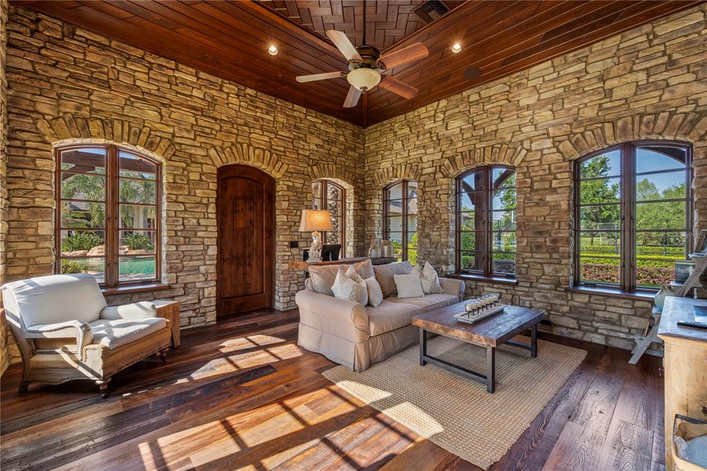9121 Tibet Pointe Circle Windermere, FL 34786 - Photo 73 of 100 a living room with furniture and a large window