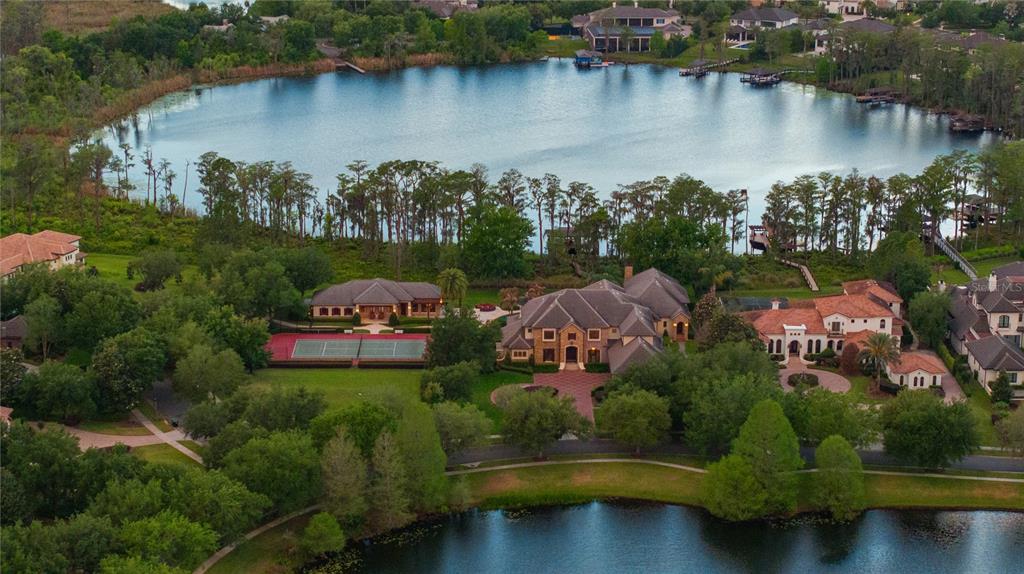 9121 Tibet Pointe Circle Windermere, FL 34786 - Photo 80 of 100 an aerial view of lake residential house with outdoor space and swimming pool