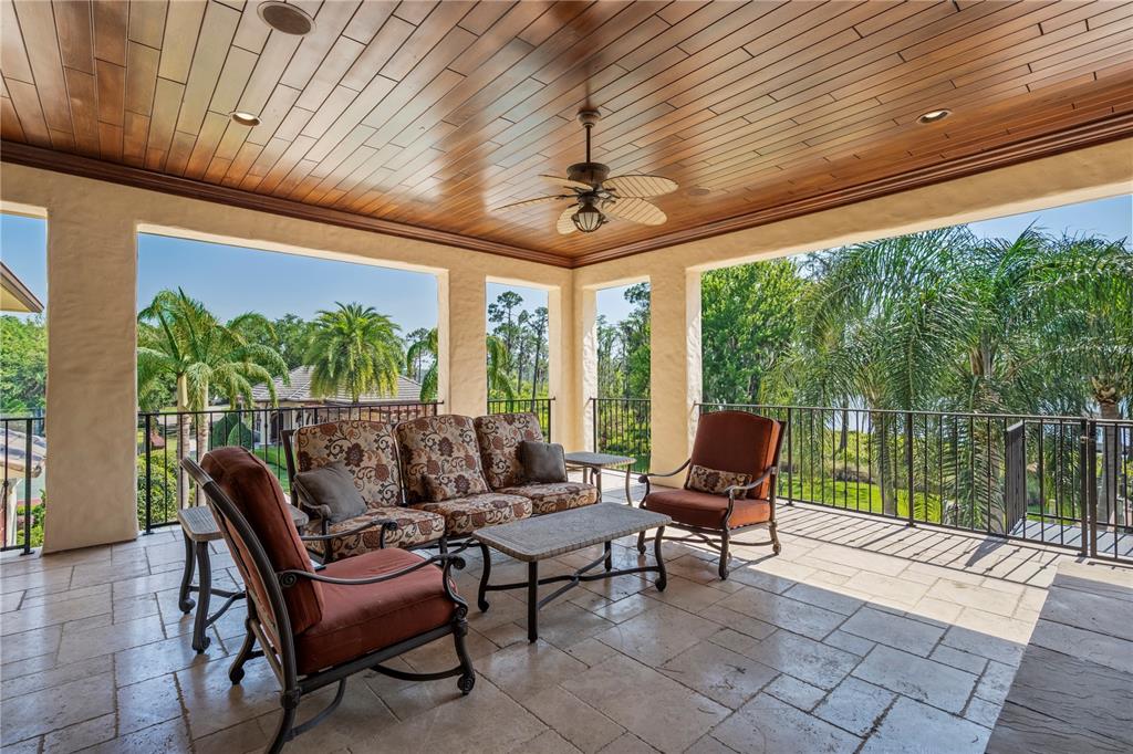 9121 Tibet Pointe Circle Windermere, FL 34786 - Photo 88 of 100 a outdoor living space with furniture and garden view