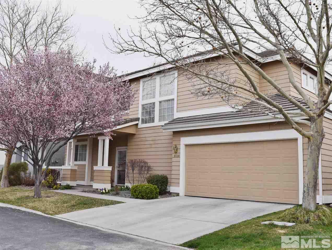 9680 Otter Way Reno, NV 89521 - Photo 1 of 1 a front view of a house with a yard and garage