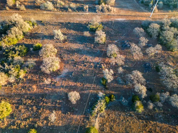 an aerial view of house with yard