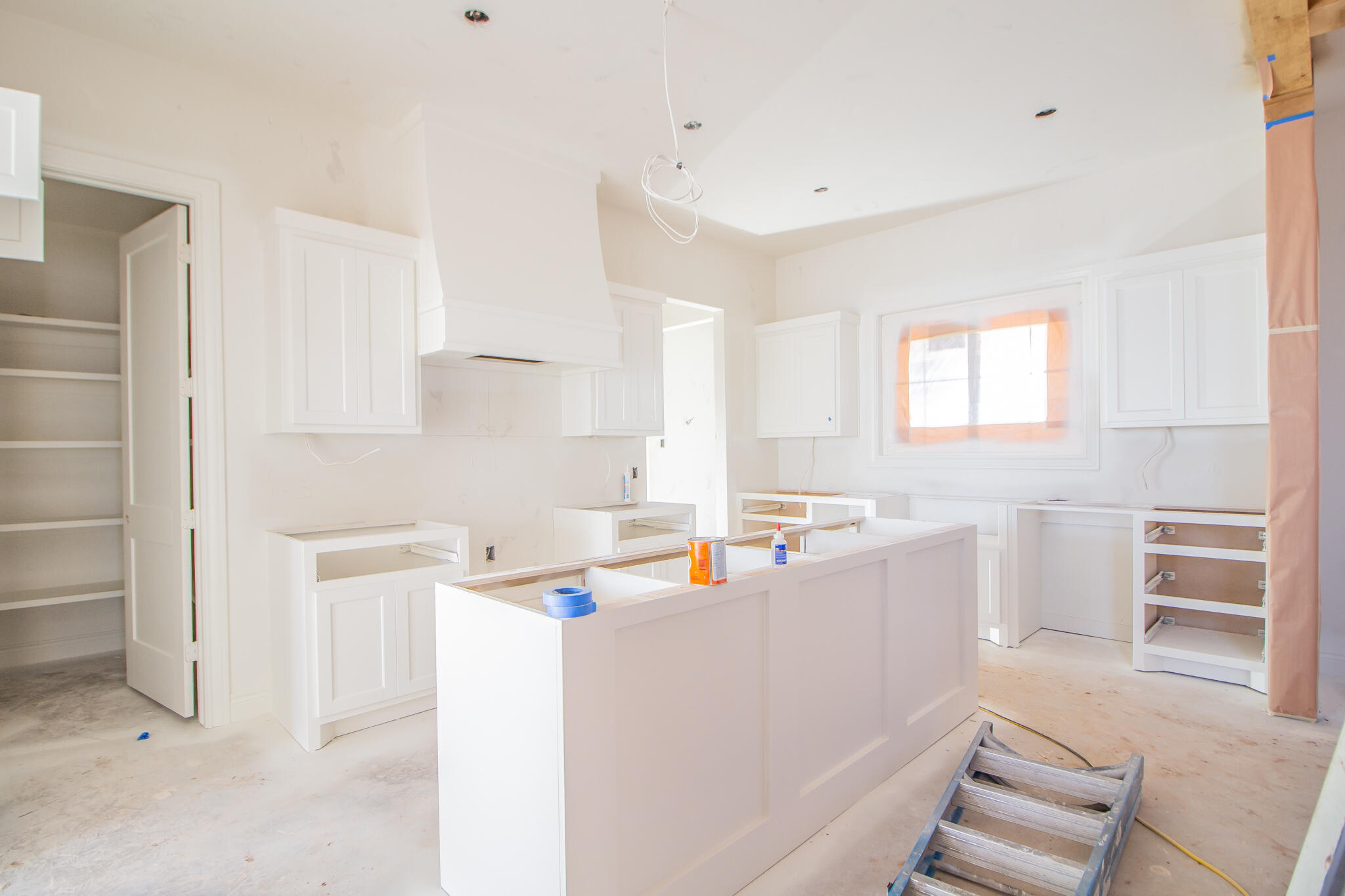 3116 County Road 7660 Lubbock, TX 79423 - Photo 5 of 15 a kitchen with a sink a stove a refrigerator and white cabinets