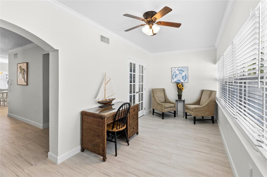 19417 Gulf Boulevard, Unit C109 Indian Rocks Beach, FL 33785 - Photo 10 of 48 a living room with furniture