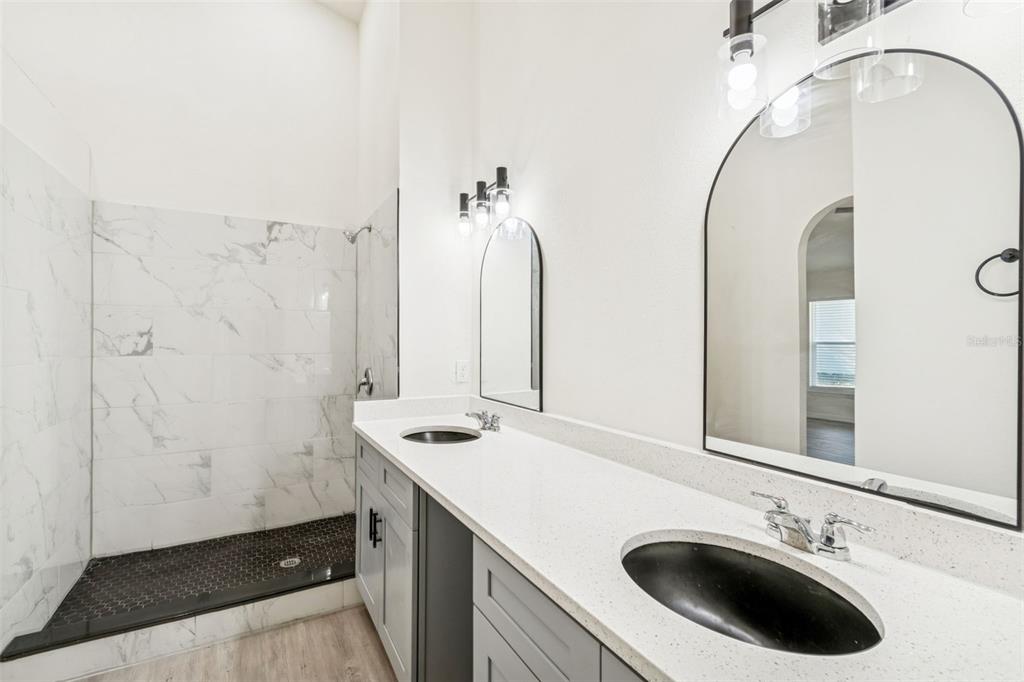 119 Winchester Lane Haines City, FL 33844 - Photo 16 of 24 a bathroom with a sink and a mirror