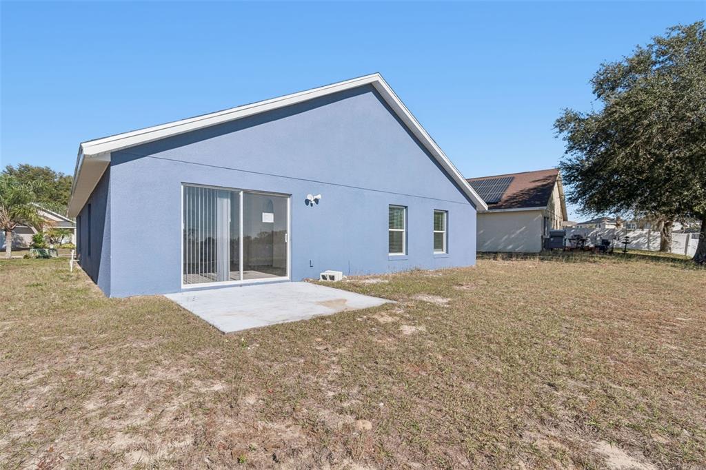 119 Winchester Lane Haines City, FL 33844 - Photo 24 of 24 a view of house with yard and garage
