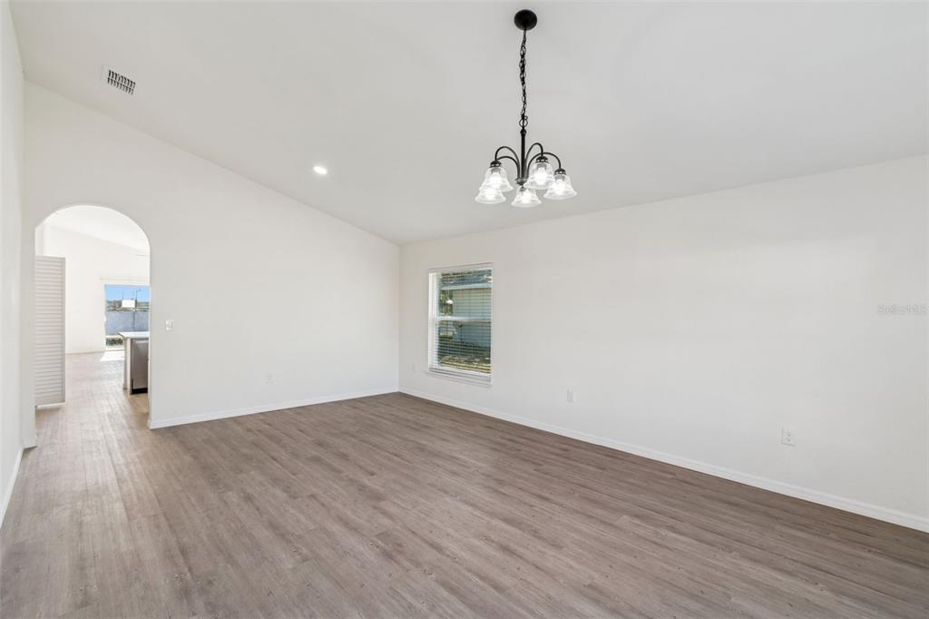 119 Winchester Lane Haines City, FL 33844 - Photo 4 of 24 a view of empty room with wooden floor