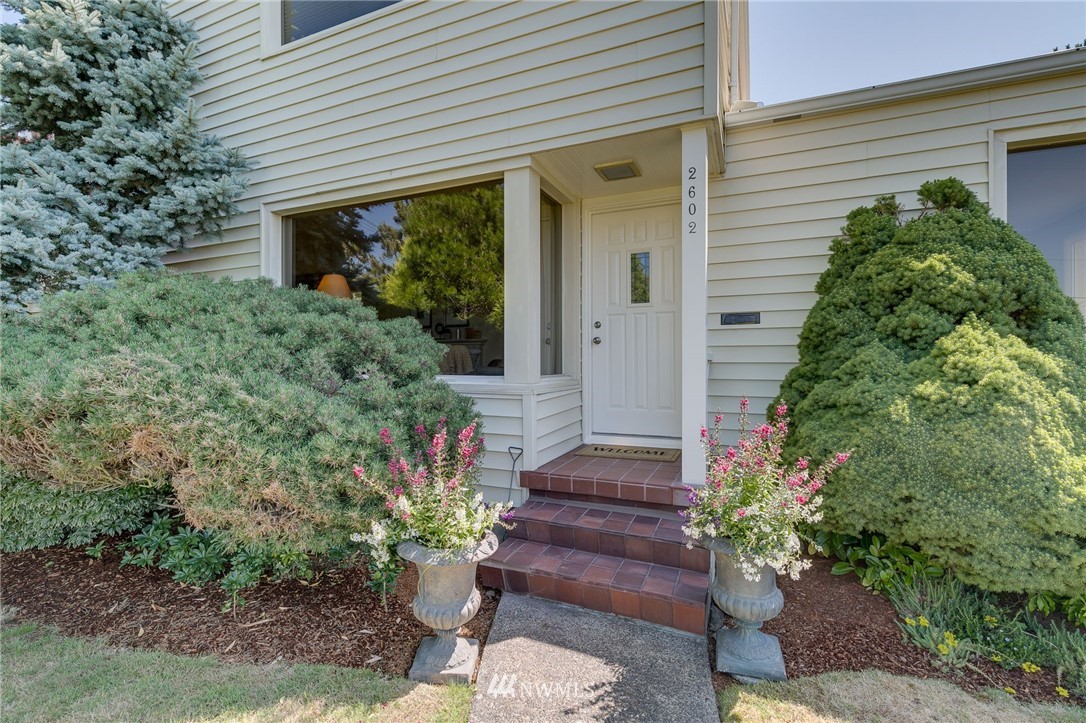 2602 29th Avenue West Seattle, WA 98199 - Photo 2 of 40 a front view of a house with a yard