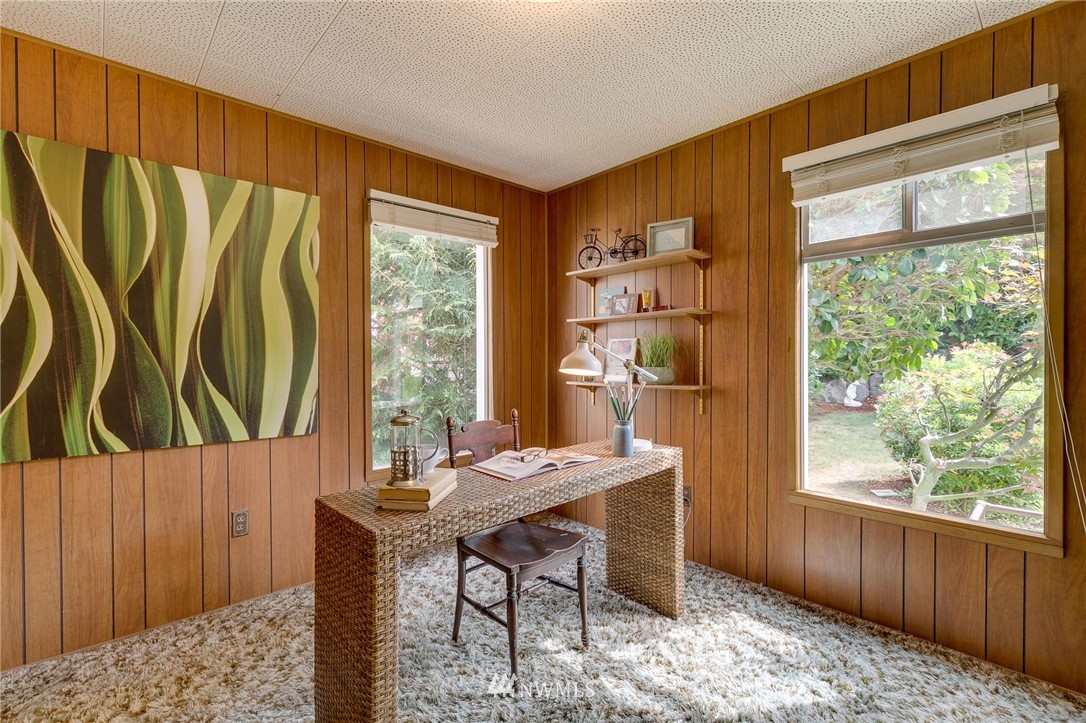 2602 29th Avenue West Seattle, WA 98199 - Photo 15 of 40 a view of a dining room with furniture window and outside view