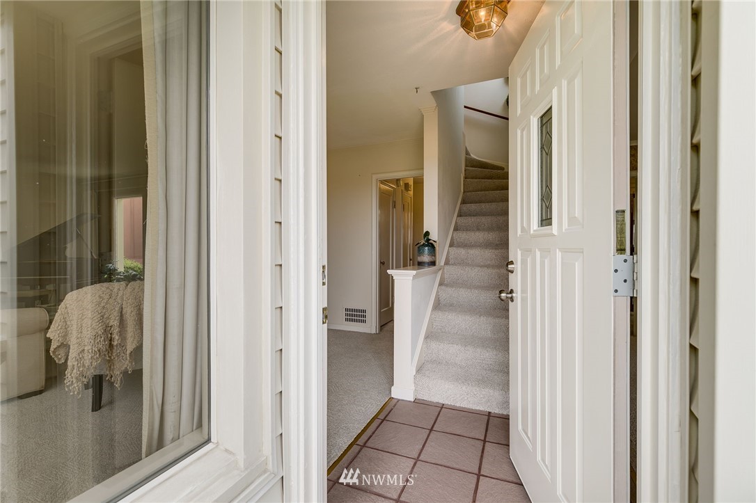 2602 29th Avenue West Seattle, WA 98199 - Photo 3 of 40 a view of a hallway view with wooden floor and staircase