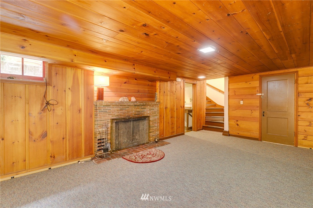 2602 29th Avenue West Seattle, WA 98199 - Photo 23 of 40 a view of an empty room with a fireplace