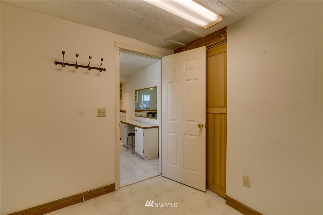 2602 29th Avenue West Seattle, WA 98199 - Photo 29 of 40 a view of a bathroom with a sink and a mirror