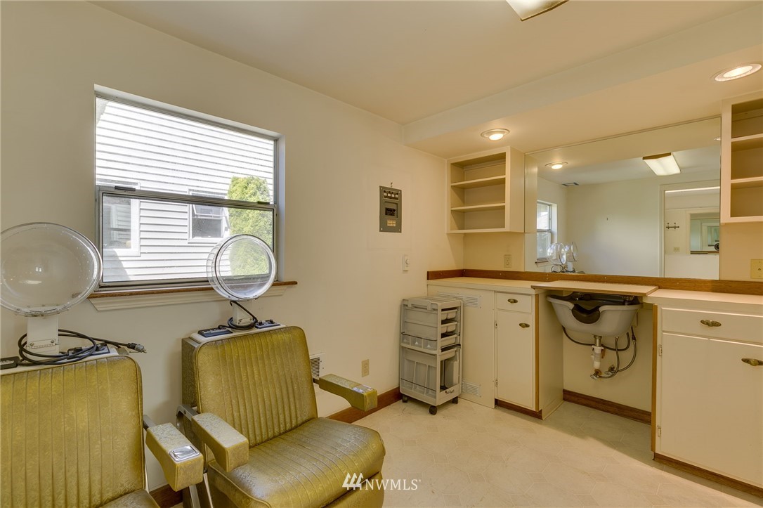 2602 29th Avenue West Seattle, WA 98199 - Photo 30 of 40 a room with cabinets and a chair