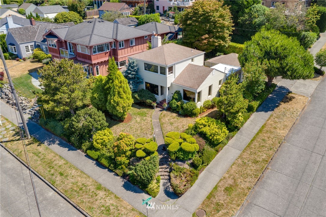 2602 29th Avenue West Seattle, WA 98199 - Photo 35 of 40 an aerial view of a house with a garden and mountain view in back yard