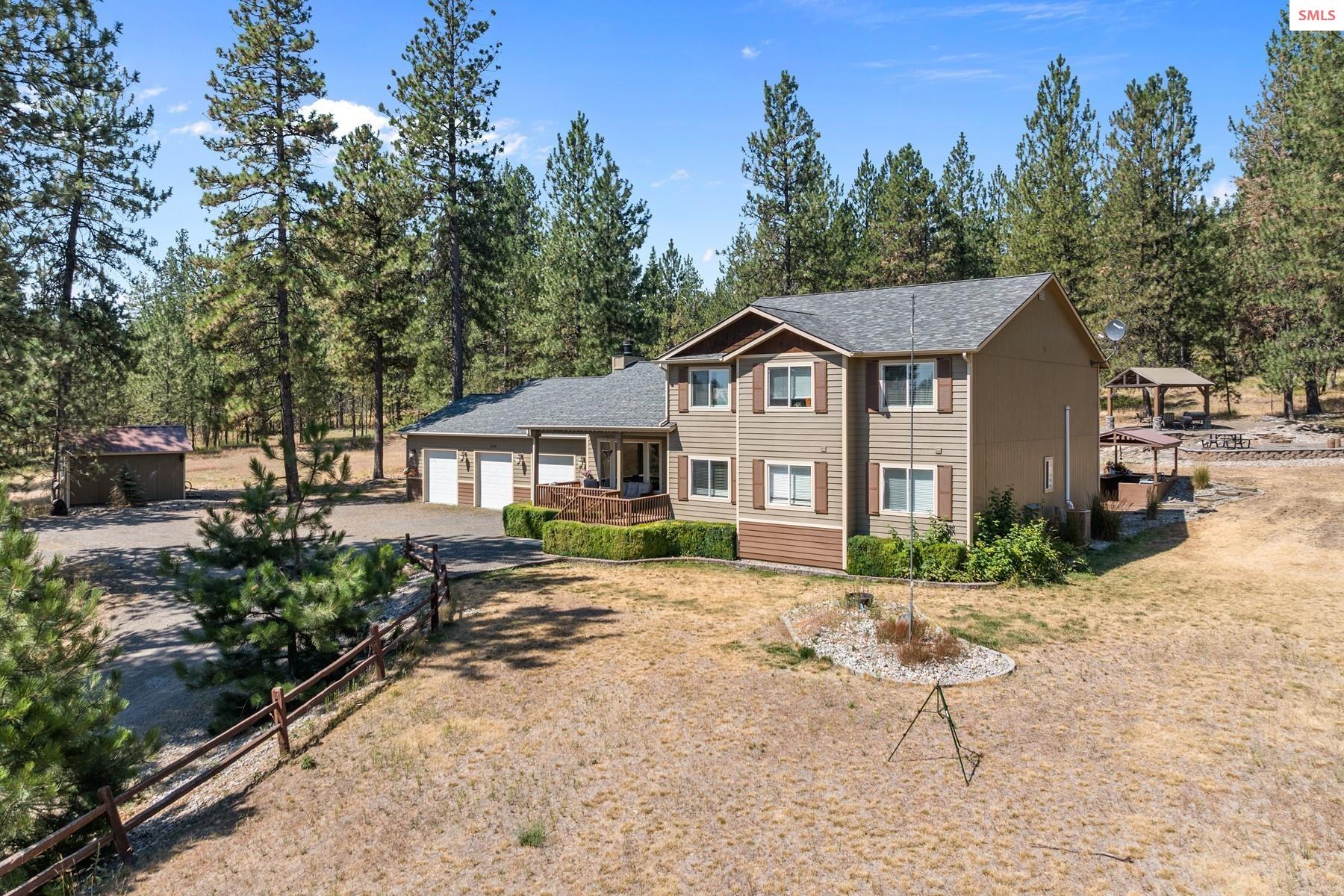 18341 West Highway 53 Rathdrum, ID 83858 - Photo 23 of 41 This home offers space for all activities on 5 treed acres.