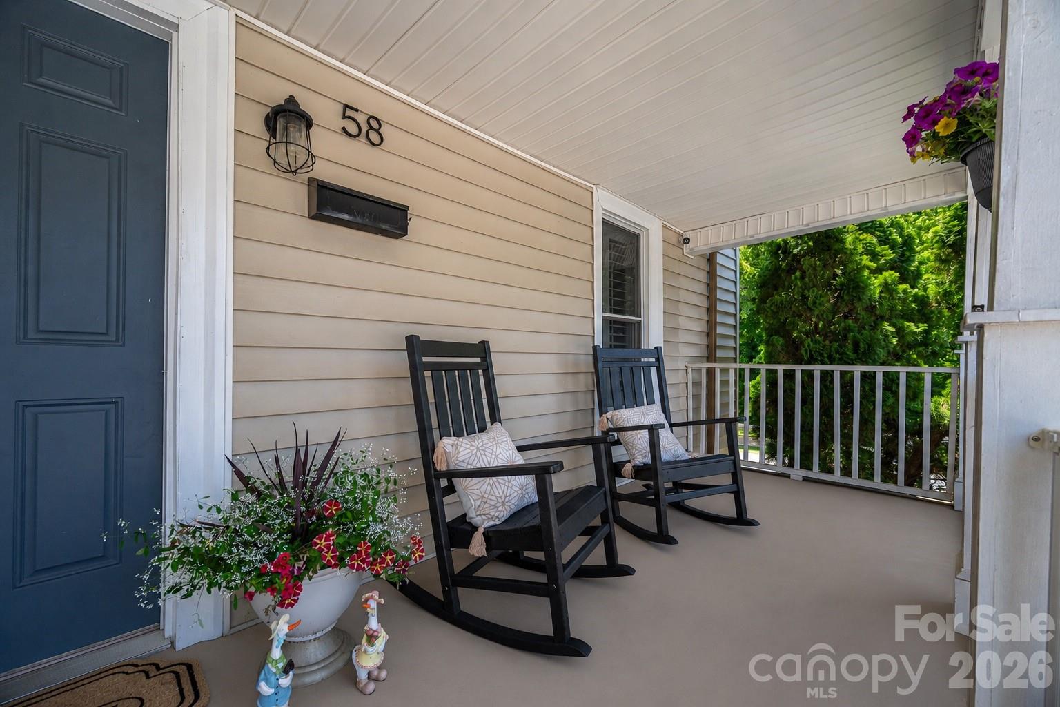 58 Fourth Street Cramerton, NC 28032 - Photo 8 of 44 a balcony with furniture and flowers