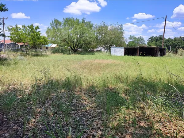 a view of a lake with a yard