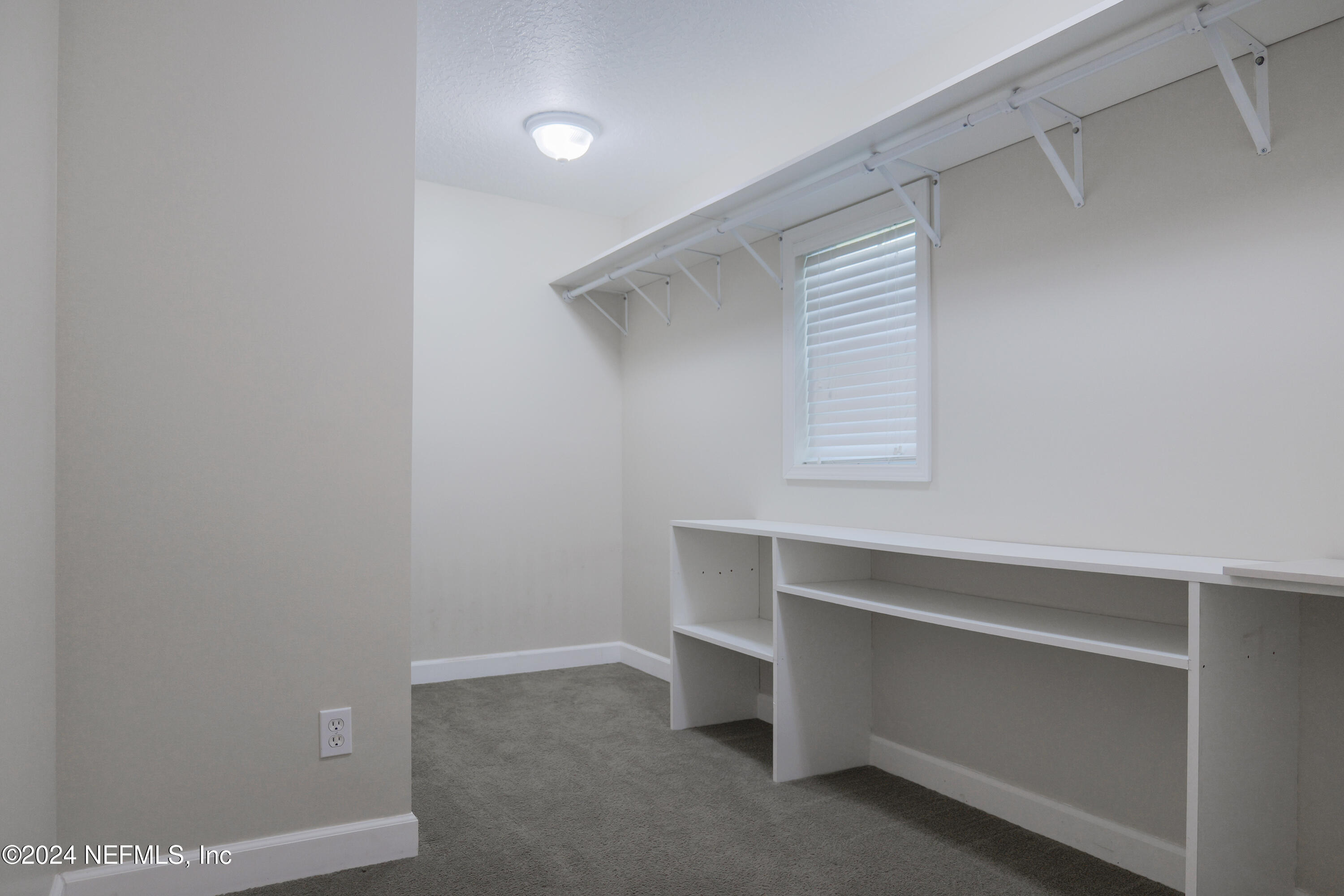 6566 Sherry Lane St. Augustine, FL 32095 - Photo 11 of 24 a room with a desk and a window